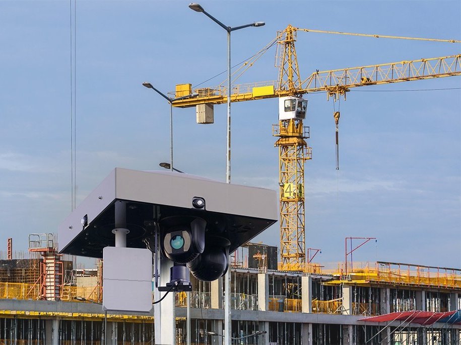 Motorised 360 degree dome of an OMNIGARD tower, construction cranes in the background